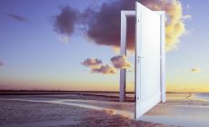 surreal image of floating door over the ocean at sunset