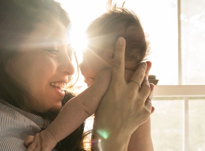 img-mother-lifting-baby-in-sunlight-1200x630px2x.jpg